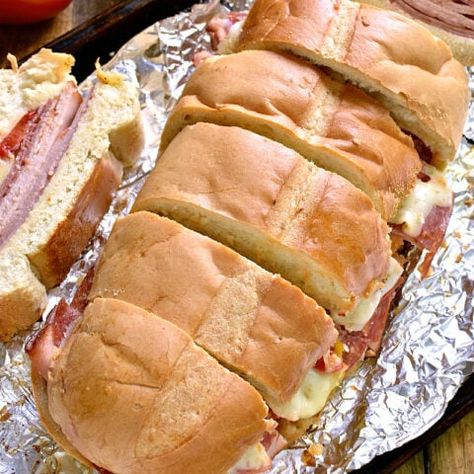 Italian Party Sub - Lemon Tree Dwelling Italian Vinaigrette, Lemon Tree Dwelling, Italian Themed Parties, Sub Sandwich, Sliced Salami, Italian Party, Italian Sub, Turkey Ham, Italian Theme