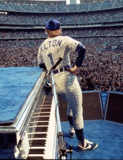 Elton John in custom beaded LA Dodgers uniform by Bob Mackie Elton John Dodger Costume, Elton John Fashion, Elton John Dodgers, Elton John 70s, Rocket Man Elton John, Elton John Costume, Elton John Rocket Man, Captain Fantastic, Rocket Man