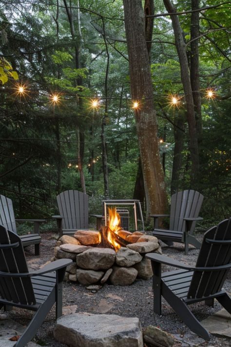 Get inspired with 40 unique backyard fire pit designs that fit any small yard. These simple, budget-conscious ideas include DIY options for both square and round pits, perfect for creating a cozy outdoor lounge space. Fire Pit Lakeside, Fire Pit In The Woods Ideas, Forest Lounge Ideas, Fire Pit Cabin, Rustic Firepit Outdoor, Fire Pit Cottage, Large Rock Fire Pit, Lake Fire Pit, Forest Fire Pit