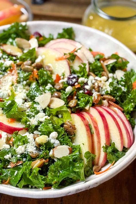 This Kale Salad recipe features fresh, crunchy kale, shredded carrots, toasted almonds, dried cranberries, and crispy sliced apples tossed with the most delicious lemon dressing. It's my all-time favorite kale salad, with hints of savory, sweet, and salty flavors! Simple Christmas Dinner, Easy Christmas Dinner Recipes, Easy Holiday Dinner, Healthy Kale Salad, Sweet Potato Breakfast Casserole, Kale Salad Dressing, Panera Autumn Squash Soup, Christmas Dinner Recipes Easy, Pumpkin Soup Easy