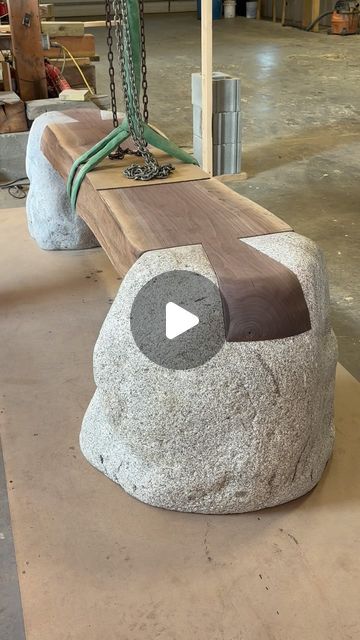 Ethan Stebbins on Instagram: "Dovetail bench in progress.  Black walnut and granite boulders.  @atelierscourbet  @nicolehollissf" Wood And Stone Furniture, Stone Table Design, Garden Bench Ideas, Log Furniture Plans, Black Walnut Table, Carved Bench, Diy Wood Bench, Rustic Log Furniture, Wood Stumps