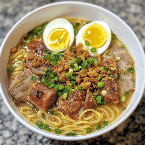 🍜✨ Experience the savory goodness of Batchoy, a classic Filipino noodle soup! #Batchoy #FilipinoFood Batchoy Ingredients: Pork belly (1 lb, sliced) Pork liver (0.5 lb, sliced) Egg noodles (4 cups, cooked) Garlic (4 cloves, minced) Onion (1, chopped) Shrimp paste (2 tbsp) Fish sauce (3 tbsp) Pork broth (6 cups) Chicharron (1 cup, crushed) Green onions (for garnish) Hard-boiled eggs (2, halved) Instructions: In a pot, sauté garlic and onion until fragrant. Add pork belly and liver, cook unt... Batchoy Recipe Filipino Food, Filipino Noodles, Phillipino Food, Filipino Soup, Twist Recipes, Pork Liver, Pork Broth, Instagram Recipes, Food Reference