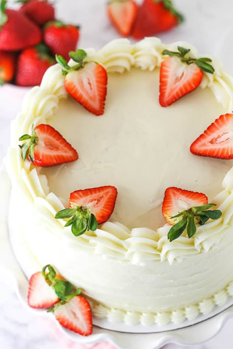 Layered with a tangy 4-ingredient cream cheese frosting, this sweet and tender Strawberry Cake is a fresher, yummier version of your favorite box mix! #strawberrycake #creamcheesefrosting #strawberrycakemix #strawberrydessert #homemadecake #cakerecipes #frostingrecipes #dessertideas Strawberry Filling Recipe, White Cake With Strawberry Filling, Simple Cream Cheese Frosting, Homemade White Cake, Strawberry Cake Decorations, Cake With Strawberry Filling, Life Love And Sugar, Strawberry Layer Cakes, Homemade Strawberry Cake