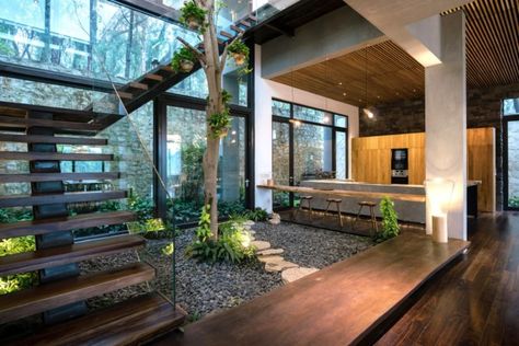 Nature-inspired Teak House welcomes Vietnam’s forests indoors | Inhabitat - Green Design, Innovation, Architecture, Green Building Indoor Courtyard, Rustic Outdoor Decor, Industrial Home Design, Courtyard Design, Interior Plants, Industrial Home, Earthship, Courtyard House, Interior Garden