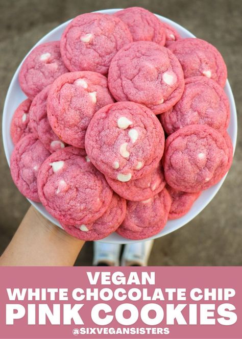 These pink and white cookies are the ultimate V-Day treat! They're a cross between a sugar cookie and a chocolate chip cookie, with a festive twist. They're soft, chewy, and bursting with white chocolate chips. #vegan #vegandesserts #vegancookies #cookies #cookierecipe #valentinesday #valentinesdaydesserts #sixvegansisters Six Vegan Sisters, Pink Party Foods, Pink Snacks, Pink Treats, White Cookies, Vegan White Chocolate, Pink Desserts, Pink Cookies, White Chocolate Chip