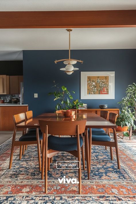 ♥ Are you ready to upgrade your dining room with a touch of Mid Century modern elegance? Feast your eyes on this stunning dining room featuring a stylish Mid Century modern dining room table and colorful wall art. Get inspired with Mid Century modern dining room decor ideas now! 🍽️🎨 #mcmdinningroom #midcenturydecor #diningroominspiration Dining Room Decor 70s, Dining Mid Century Modern, Mid Century Meets Traditional, Jewel Toned Dining Room, Small Mcm Dining Room, Boho Mcm Dining Room, Deep Blue Dining Room, Mid Century Style Home, Peacock Blue Dining Room