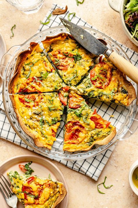 Did you know you could make a quiche with a tortilla crust? YES! This delicious tomato basil tortilla quiche is fun, easy to make, and packed with protein thanks to the eggs and cottage cheese. Customize with your favorite mix-ins for the perfect meal prep breakfast during busy weeks! Tomato Basil Quiche, Basil Quiche, Eggs And Cottage Cheese, Ww Breakfast Ideas, Sweet Potato Crust Quiche, Tortilla Quiche, Ambitious Kitchen Recipes, Autumn Cooking, Bakery Style Blueberry Muffins