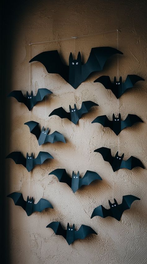 Add a spooky touch to your Halloween decor with these DIY paper bats! Perfect for creating a haunting atmosphere, these easy-to-make wall decorations bring a festive flair to any room. Simply cut out bat shapes from black construction paper and arrange them in a flight pattern across your walls. Bat Window Decor, Diy Halloween Decorations With Construction Paper, Construction Paper Halloween Decorations, Paper Bats On Walls, Homemade Halloween Decorations Indoor, Paper Bats Diy, Construction Paper Bats, Diy Paper Bats, Fall Decor Paper