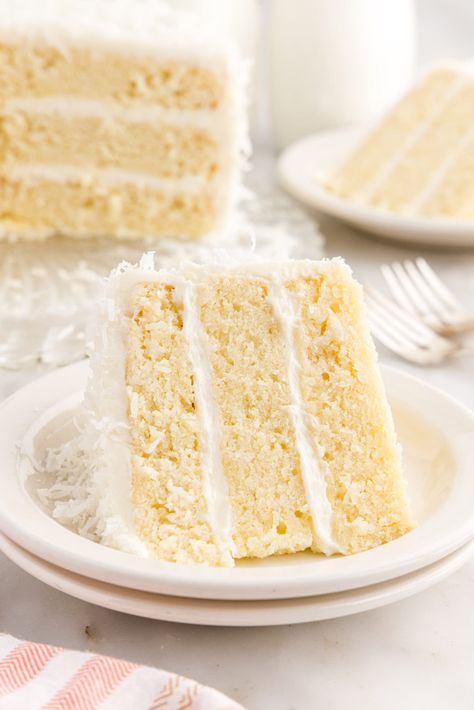 This gorgeous coconut cake is soft, rich, and tender bursting with sweet coconut flavor. The fluffy cream cheese frosting and shredded coconut complete this cake for the perfect bite every time. Coconut Cake With Coconut Milk, Coconut Cake From Scratch, Cake With Coconut Milk, Dairy Free Cream Cheese Frosting, Vegan Coconut Cake, Moist White Cake, Fluffy Cream Cheese Frosting, Coconut Buttercream, Cake With Coconut