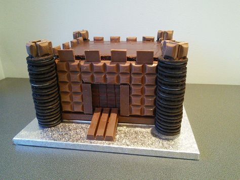 Chocolate bar castle cake. Cadbury's dairy milk, kit kat and Oreo's Mario Castle Cake, Bowser Castle Cake, Cadbury Cake, How To Make A Castle Cake, Knight Castle Cake, Chocolate Castle, Mini Castle Cake, Chocolate Castle Cake, Easy Castle Cake