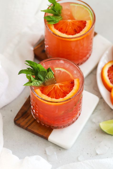 This naturally sweetened Blood Orange Mocktail is the perfect non-alcoholic drink for the holidays + special occasions! Made with vibrant fresh blood orange juice, a twist of lime, a few fresh finishes, and plenty of fizz, this holiday mocktail recipe is PACKED with flavor! As a bonus, this citrus spritzer is also made without refined sugar, so it's paleo approved! Get the recipe and more healthy mocktail recipes to try at One Lovely Life Sugar Free Mocktails Non Alcoholic, Blood Orange Mocktail, Healthy Mocktail, Best Mocktail Recipe, Orange Mocktail, Holiday Mocktail, Festive Holiday Drinks, Blood Orange Juice, Mocktail Recipes