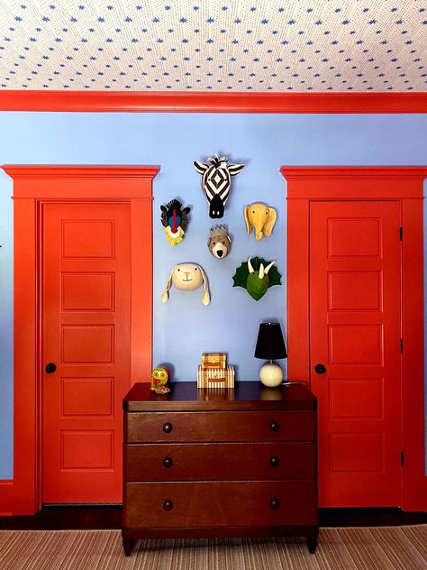 red doors kids room Blue And Red Kids Bedroom, Blue And Red Kids Room, Kids Red Bedroom, Red Door Interior, Blue And Red Nursery, Blue And Red Boys Room, Eclectic Boy Nursery, Colourful Baby Room, Bold Nursery Ideas