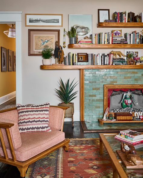 Green bricks in front of living room fireplace with book filled shelves on top. Shelves In Fireplace, Brick Fireplace Shelving Ideas, Fireplace Book Shelf, Book Shelf Around Fireplace, Brick Fireplace Decor Ideas Living Rooms, Books On Fireplace Mantle, Plants In Fireplace, Shelves Above Fireplace, Unusable Fireplace