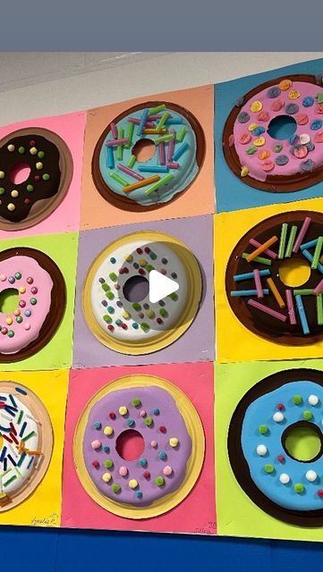 Lauralee Chambers🌀 on Instagram: "Time to share the donuts!!!

This was a really engaging and successful lesson for all 7 third grade classes! I had my husband drill holes in stacks of 10 plates with a circle drill. 10” plates are mounted on 12x12” paper with hot glue. Frosting and donuts are tempera and almost all toppings were grabbed at @retakeremake my go to for all things art! Displaying these was a game of strategy to get a variety in three rows across 36’ x3’ bulletin board. If you only see my posts, be sure to check out my stories every day!

@mychinet @retakeremake @dunkin @earthlingerin thanks for your 2017 post. I never forgot it🩷" Donut Shop Classroom Transformation, Donut Activity Preschool, Paper Plate Donut Craft, Preschool Donut Craft, Food Themed Art Projects For Kids, Donut Day Activities, Family Crafts For Preschool, Smart Cookie Craft, Donut Art Project For Kids