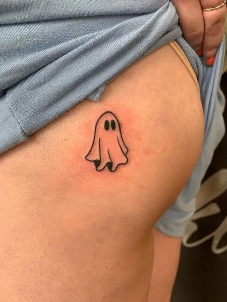 Ghost Butt Tattoo Cute Halloween Ghost Tattoo, Small Ghostface Tattoo Simple, Small Ghost Tattoo Placement, Ghost Emoji Tattoo, Ghost Patchwork Tattoo, Ghost Ankle Tattoo, Ghost Holding Balloon Tattoo, Punny Small Tattoos, Tiny Jack O Lantern Tattoo