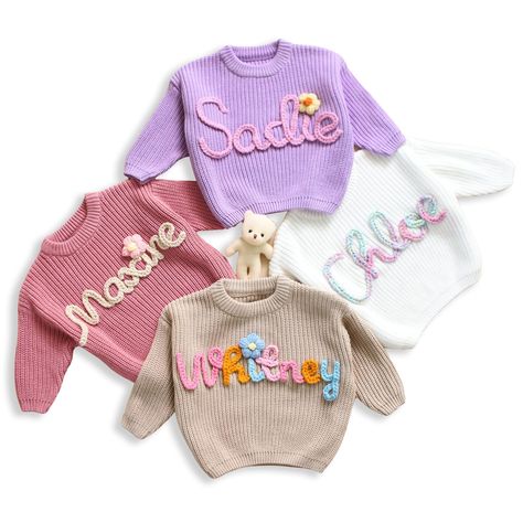 PRICES MAY VARY. 💝 CUSTOMIZE: You can custom name on a sweater. Click the "Customize Now" button to design your own shirt and create the best personalized gift for a loved one. 💝 HIGH-QUALITY MATERIAL: These knit sweaters with name are made with a distinctive soft and comfortable cotton blend it will make you feel soft and comfortable all day, cozy and breathable 🎁OCCASIONS: This embroidered knit sweater is the perfect gift for a mom-to-be or baby shower! Suitable for birthday, Christmas, Win Crochet Sweater Baby, Name Sweater Baby, Baby Sweater Crochet, Sweater With Name, Baby Name Sweater, Newborn Sweater, Hand Embroidered Name, Baby Jumpers, Name Sweater