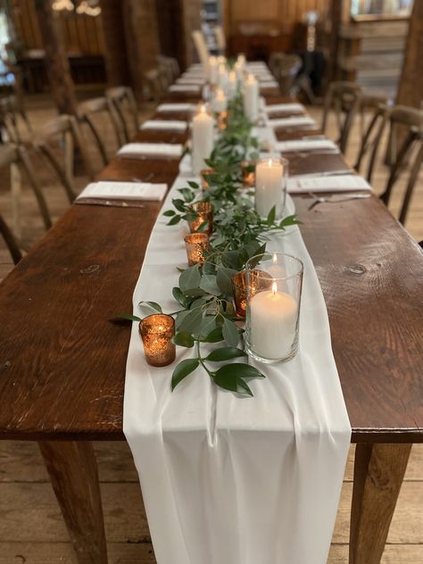 Rustic Wedding Centerpieces Rectangle Tables, Long Table Wedding Centerpieces Rustic, Fall Garland Centerpieces For Table, Simple Engagement Table Decor, Candle And Greenery Table Decor, Rustic Table Setting White Table Cloth, Boho Wedding Candles Table Settings, How To Decorate Rectangle Tables Wedding, Round Boho Table Setting