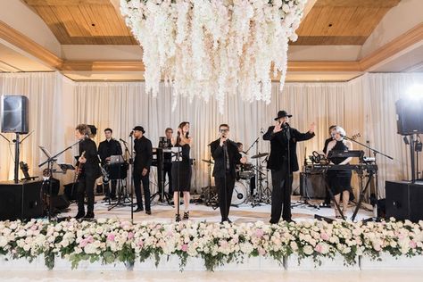 Sophisticated Soirée with Luxurious Floral Décor in California | Blush wedding reception Stage At Wedding Reception, Wedding Band Decor, Stage Flowers Wedding, Wedding Stage Flowers, Band At Wedding Reception, Stage Facade Wedding, Band Stage Wedding Decor, Wedding Band Stage Decor, Band Stage Wedding