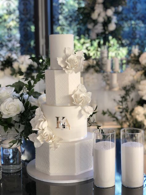 A beautiful mixture of round and hexagon tiers for this four teir modern wedding cake, featuring lattice stenciling, white sugar flowers and gold monogram. Square Tier Wedding Cake, Wedding Cakes Stencil, Octagon Wedding Cake, Hexagon Wedding Cakes, 4tier Wedding Cake, Traditional White Wedding Cake, Hexagon Cake Design, Four Tier Wedding Cakes, 4 Tier Wedding Cake Elegant