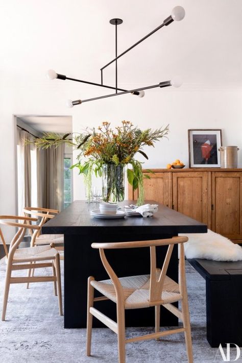 Modern light fixture above dark wood dining table. Mid Century Dining Room, Black Dining, Ashley Tisdale, Dining Table Black, Hollywood Hills, Dining Room Inspiration, Black Table, Dining Room Ideas, Modern Dining Room