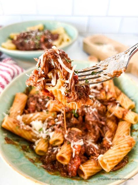 Short rib rigatoni is one of the ultimate comfort foods. It's hearty, filling, and downright delicious. Plus, it's easy to make at home in your own kitchen! In this recipe, we'll show you how to create a restaurant-style braised short rib ragu that will leave you wanting more. This beef short rib dutch oven dish is sure to be a family favorite! Short Rib And Pasta, Braised Short Rib Rigatoni, Braised Beef Rigatoni, Short Ribs Pasta Recipe, Short Rib Rigatoni, Short Rib Pasta Recipe, Short Ribs Ragu, Braised Short Rib Pasta, Short Rib Pasta