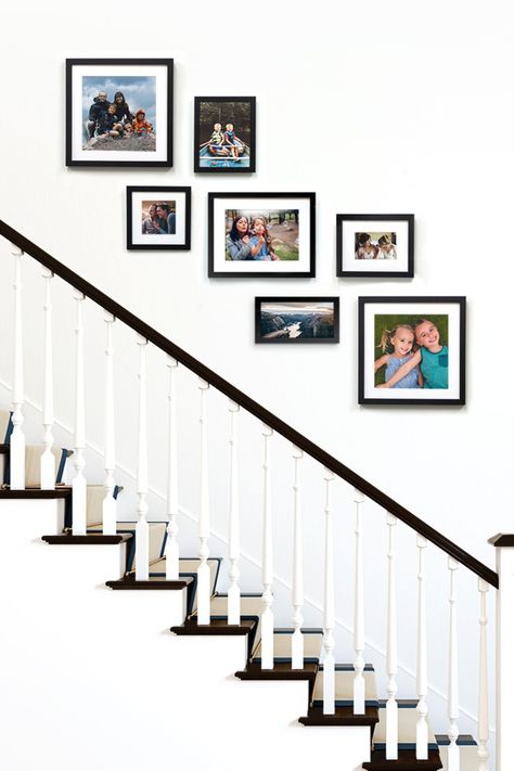 Black gallery wall of frames over a staircase. Photo Frame Staircase, Photo Frames On Staircase Wall, Frame Wall Ideas Stairs, Home Decor Stairway Wall, Photo Frames Up The Stairs, Staircase Wall Frames Ideas, Stairs Frames Ideas, Wall Picture Collage Ideas Stairs, Staircase Gallery Wall Minimal