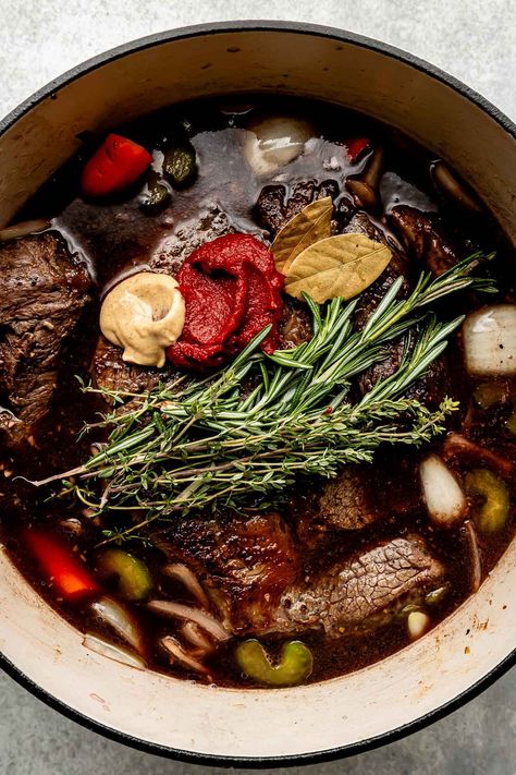 You don't need an expensive cut of beef to make a restaurant-worthy meal – this Red Wine Braised Beef recipe is proof! Slowly simmer beef chuck roast with red wine, vegetables, & herbs until it transforms into a succulent centerpiece complete with a built-in red wine sauce. Serve with creamy mashed potatoes for the best cozy dinner! (Slow cooker/Crockpot & Instant Pot directions provided.) #redwinebraisedbeef #redwinebeefroast #braisedbeef ##braisedbeefroast #beefroast #beefrecipes #dinnerideas Red Wine Beef Roast, Cooking Chuck Roast, Roast With Red Wine, Red Wine Braised Beef, Wine Braised Beef, Braised Beef Recipes, Dinner Slow Cooker, Chef Ramsey, 2025 Recipes