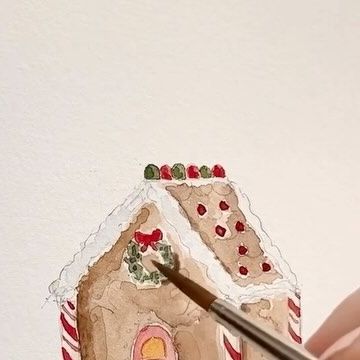 Emily Lex on Instagram: "Painting a gingerbread house. This cutie is featured on the cover of the Christmas watercolor workbook and you can paint along with me inside the book! (p.s. for the white, I used white gauche - you could also use a white gel pen). #elstudio #watercolor #watercolorwednesday #gingerbreadhouse" Gingerbread House Watercolor Painting, Watercolour Gingerbread House, Christmas House Watercolor, Watercolor Gingerbread Man, Easy Christmas Watercolor Paintings, Gingerbread House Watercolor, Watercolor Gingerbread House, Hand Painted Christmas Cards Watercolors, Watercolor Christmas Paintings