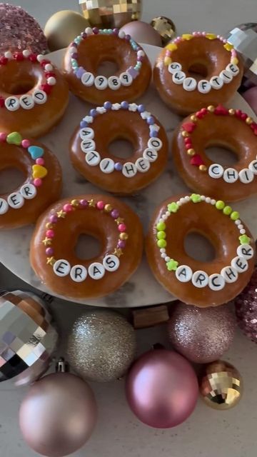 Brookie Cookie on Instagram: "How fun are these friendship bracelet donuts!?! Would be adorable for a Taylor Swift party!! By @created.at.home 🍩 🤍❤️ #erastour #erastourmovie #taylorswift #donuts #krispykreme #taylornation #friendshipbracelet #taylorswiftlyrics #foodies #foodcreator #taylorswiftconcert #swiftie #karma #taylorsversion" Swiftie Superbowl Party, Taylor Swift Superbowl Party Ideas, Super Bowl Donut Ideas, 9 Birthday Party Ideas, Diy Candy Bracelets, Cute At Home Birthday Ideas, Taylor Swift Football Cookies, Taylor Swift Superbowl Party Food, Taylor Swift Superbowl Snacks