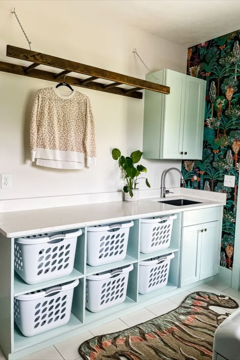 I have been giving my laundry room a much-needed DIY makeover these past few weeks and, friends, it’s time for the big reveal! I’m sharing the entire before and after, including our makeover wallpaper and all of the finer details! This consisted of rehanging the upper cabinets, reattaching cabinet doors, building an open shelf, cleaning, and accessorizing. #laundryroom #laundryroommakeover #wallpaper #homedecor Diy Laundry Room Makeover, Laundry Room Decor Ideas, Laundry Room Organization Ideas, Laundy Room, Laundry Room Design Ideas, Laundry Room Hacks, Laundry Room Wallpaper, Room Organization Ideas, Laundry Room Closet