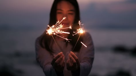 Young Asian woman holding sparkler. Fireworks Reference, Holding Sparkler, Sparkler Photography, Portrait Character, South Asian Aesthetic, Camera Film, Film Photo, Free Stock Video, Just Beautiful