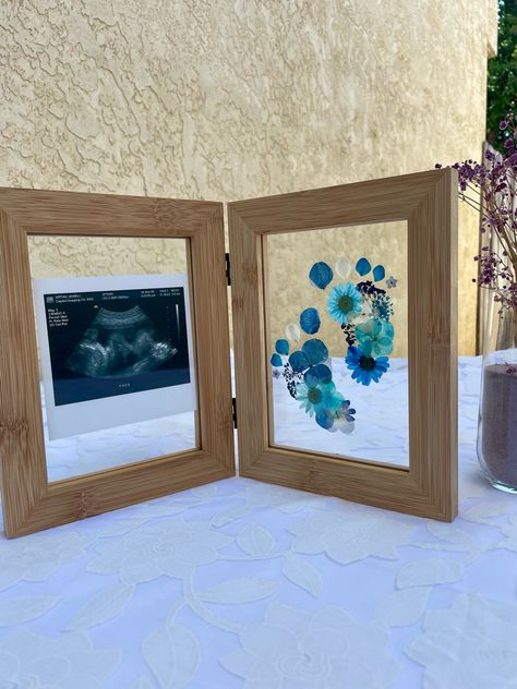 It’s a Boy! Pressed flowers baby feet. You can add birth announcement, ultrasound or whatever you want. Baby Feet Flowers Footprint Art, Ultrasound Frame Ideas, Sibling Crafts, Flower Footprint, Pressed Flowers Framed, Sonogram Picture Frame, Ultrasound Frame, Baby Art Crafts, Pressed Flowers Frame