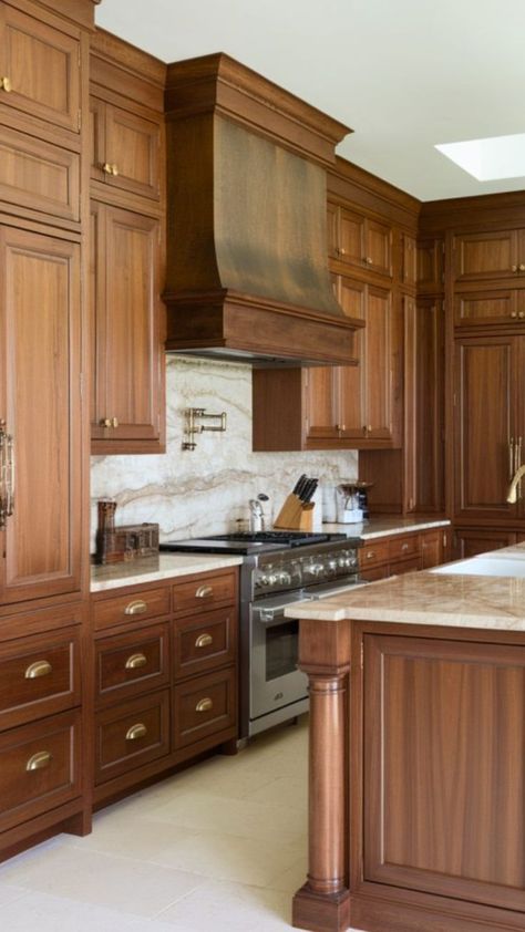 Close-up of modern kitchen with sleek, dark walnut cabinets, white quartz countertops, stainless steel appliances, and minimalist décor, showcasing the warm grain and natural finish of the wood. Walnut And Cream Interior, Wood Stain Kitchen Cabinets Ideas, Medium Walnut Kitchen Cabinets, Redwood Kitchen Cabinets, Knotty Walnut Kitchen Cabinets, Kitchen With Medium Wood Cabinets, Taj Mahal Quartzite Countertops Walnut Cabinets, Traditional Kitchen Design Wood Cabinets, Kitchens With Walnut Cabinets