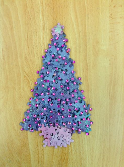 Christmas Tree made from Jigsaw Puzzle pieces with sequin decorations Puzzle Crafts Wall Art, Puzzle Piece Christmas Crafts, Puzzle Piece Christmas Tree, Crafts With Puzzle Pieces, Puzzle Tree Craft, Puzzle Pieces Art, Puzzle Wreath, Sequin Decorations, Jigsaw Puzzle Crafts