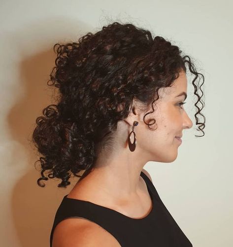 15 Smartest Messy Buns for Curly Hair [2023] Short Curly Hair In Ponytail, Low Updo Curly Hair, Curly Hair Sides Pulled Up, Bun In Curly Hair, Curl Messy Bun, Side Ponytail Hairstyles Curly Hair, Mid Length Curly Hair Updo, Thick Curly Hair Updo Easy, Low Messy Bun For Curly Hair