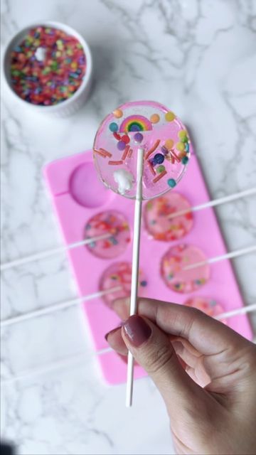 Rita Tohmé-Kikano on Instagram: "🍭 How to: Making Lollipops🍭 These next few weeks I will share with you my tricks and treats *See what I did here* for easy celebration ideas! Ingredients for the lollipops: Canola Oil 1 cup sugar 1/2 cup light corn syrup 1/4 cup water 1 1/2 teaspoons extract (I used Raspberry extract) Full Recipe in Comments" Sucker Recipe Homemade Lollipops, Homemade Lollipops Recipes, Easy Lollipop Recipe, Making Lollipops, Lollipops Diy, Homemade Lollipops, Lollipop Recipe, Making Candy, Raspberry Extract