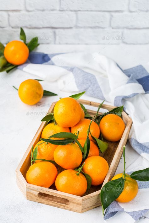 Fresh orange mandarins, tangerines with green leaves on a table by antoninavlasova. Fresh juicy organic orange mandarins, tangerines with green leaves on a kitchen table. Healthy vitamin eating concept... #Sponsored #green, #leaves, #table, #tangerines Fresh Orange, Psd Templates, A Kitchen, Christmas And New Year, Green Leaves, Kitchen Table, A Table, Vitamins, Diet