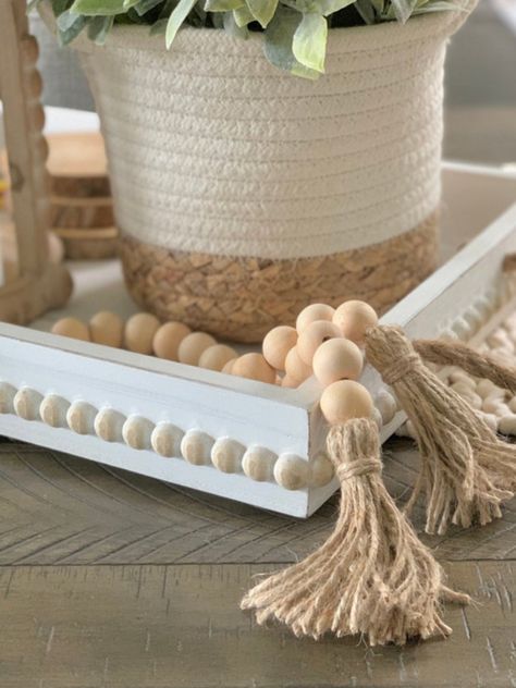 How To Display Wooden Beads, How To Style Wooden Beads, How To Decorate With Beads, How To Decorate With Wooden Beads, How To Decorate With Wooden Bead Garland, Decorative Beads In Tray, Wooden Beads Home Decor Ideas, Decorate With Wooden Beads, Beaded Garland Decor Ideas