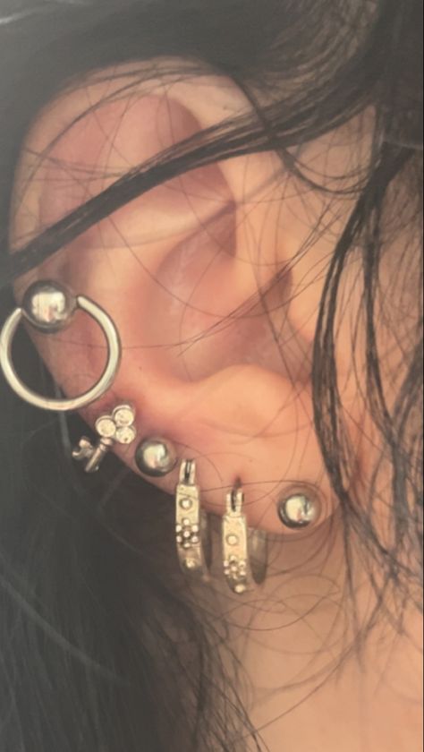 Black Ear Jewelry, Art Refence, Dream Piercings, Aesthetic Piercings, Chunky Silver Jewellery, Curated Ears, Aquarius Season, Cool Ear Piercings, Pretty Ear Piercings