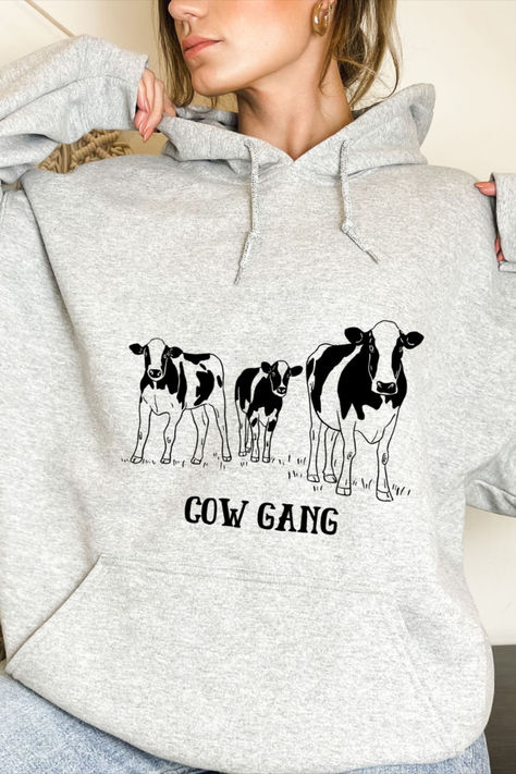 Get ready to join the Cow Gang! 🐮🤠 Our Cow Gang Hoodie is the perfect blend of style and comfort. It is the perfect mix between the farm rustic charm and the urban cool style. Available in 6 colors, there's a perfect option for every cow lover out there. Pin it now and show off your cow appreciation! 🌟 #CowGang #FashionForAll #FarmGirl Girl Hoodie, The Cow, Cute Cows, Farm Girl, Hoodie Girl, The Urban, The Farm, Rustic Charm, Hooded Sweatshirt