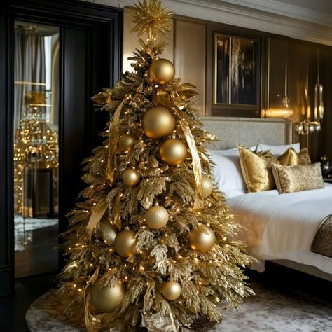 Showcasing gold tones, this extravagant tree is adorned with large ornaments and glittering ribbons for a standout festive look. Christmas Trees With Large Ornaments, Large Ornaments On Tree, Large Ornaments, Gold Christmas Tree Decorations, Gold Glam, Gold Christmas Tree, Christmas Décor, Christmas D, Christmas Mantels