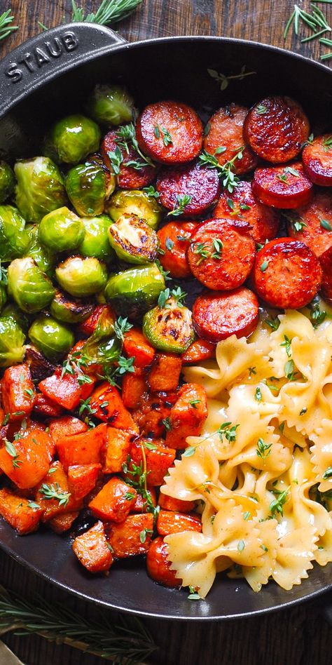 Autumn Dinner with Sausage, Pasta, Brussels Sprouts, Butternut Squash, Garlic Butter Sauce in a cast iron pan. Dinner With Sausage, Brussels Sprouts And Butternut Squash, Autumn Dinner, Bow Tie Pasta, Garlic Butter Sauce, Sausage Pasta, Fall Dinner, Skillet Meals, Smoked Sausage