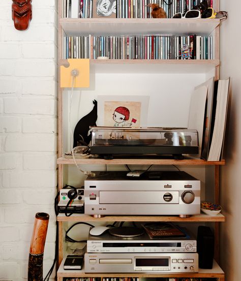 Much of the charm of architect Lukáš Kordík's small apartment in Bratislava, Slovak Republic, is in its sense of careful clutter. The ste... Record Area, Stereo Setup, Music Setup, Audio Setup, Home Music Rooms, Music Corner, Industrial Wall Decor, Stereo Cabinet, Physical Media