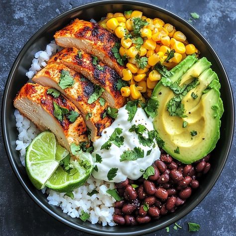 🍚🌽 Savor the flavors of street food with our Street Corn Chicken Rice Bowl! A fiesta in every bite! 🌶️ #StreetFoodStyle #DeliciousEats Street Corn Chicken Rice Bowl Ingredients: Chicken breast (2, grilled and sliced) Rice (2 cups, cooked) Corn kernels (1 cup, roasted) Black beans (1/2 cup) Avocado (1, sliced) Cotija cheese (1/4 cup, crumbled) Lime (1, juiced) Cilantro (for garnish) Sour cream (2 tbsp) Chili powder (to taste) Instructions: Arrange rice in bowls. Top with grilled chicken, r... Cuban Chicken Rice Bowl, Healthy Chicken Ideas For Dinner, Grilled Chicken With Rice Recipes, Healthy Dinner Recipes Grilled Chicken, Rice And Avocado Bowl, Veggie Chicken Bowl, Cilantro Rice Bowl, Meal With Avocado, Rice Avocado Bowl