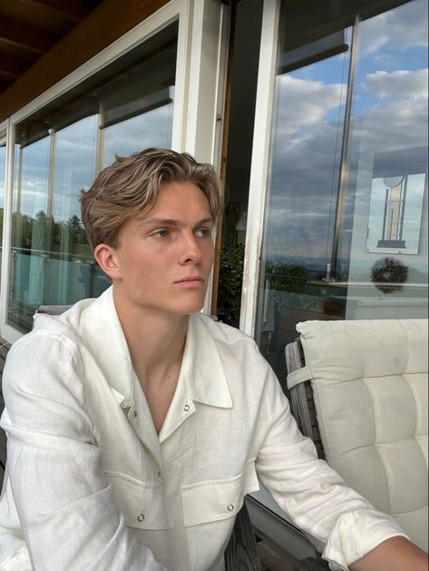 Blonde boy with middle part chilling on the balcony Male Short Middle Part, Mens Blonde Short Hair, Scandinavian Hairstyles Men, Old Money Middle Part Hair Men, Hair With Middle Part, Blonde Man Hairstyle, Men’s Short Middle Part, Mens Short Middle Part, Blond Mens Haircut