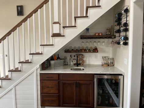 Wet bar built under stair case. Shiplap walls, hand sink, cabinets, and drink fridge Wine Case Under Stairs, Built In Cabinets Under Stairs, Kitchen Sink Under Stairs, Under Stairs Bar Ideas Built Ins, Basement Wet Bar Under Stairs, Under Stair Wet Bar, Wet Bar Under Staircase, Under Stair Coffee Bar, Under Stairs Drinks Cabinet