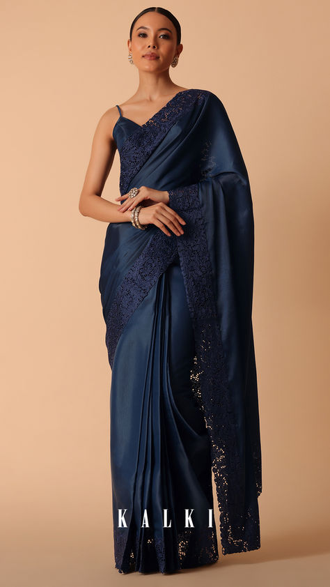 Perfect for stylish festive nights and special events, this solid saree comes decked in a striking navy blue color. Cut from rich organza fabric, it is elevated with exquisite lace trim border. Paired with an unstitched blouse piece, this beautiful drape will ensure you exude style and confidence. Midnight Blue Saree, Dark Blue Saree For Farewell, Dark Color Saree, Dark Blue Silk Saree, Bow Photoshoot, Saree Navy Blue, Dark Blue Saree, Blue Organza Saree, Solid Saree