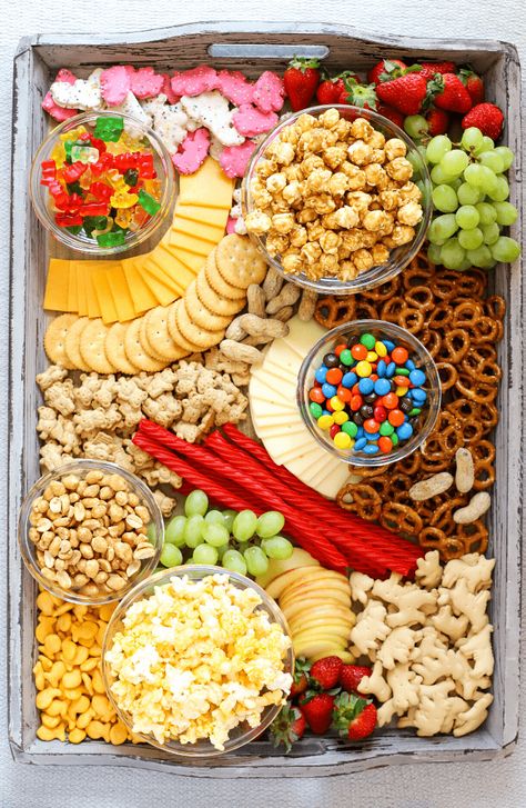 Movie Night Snack Board | Simply Made Recipes Movie Night Snack Board, Snack Boards, Movie Night Food, Charcuterie Ideas, Movie Night Snacks, Decorações Com Comidas, Snack Platter, Sleepover Food, Charcuterie Inspiration