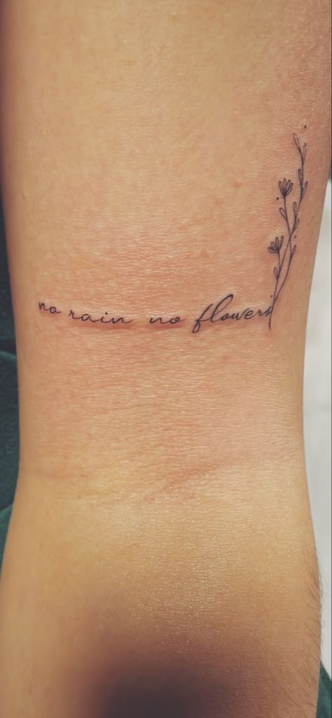 Elegant Forarm Tattoos For Women, Quote Tattoos For Women With Flowers, Small Quote With Flower Tattoo, Tattoos About Acceptance, No Rain No Flowers Cursive Tattoo, Writing Into Flower Tattoo, Fine Line Tattoos On Arm, Rain Quotes Tattoo, Tattoo Ideas For Dv Survivors