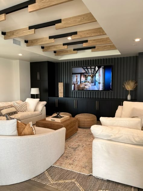 Family Room Downstairs, Movie Lounge Room, Downstairs Entertainment Room, Family Loft Ideas Upstairs Cozy, Rec Room Tv Wall, Black And Cream Basement, Home Rec Room, Sports Theme Basement Ideas, Modern Farmhouse Movie Room